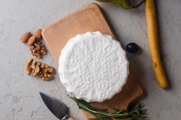 Camembert cheese with white mold walnuts and honey