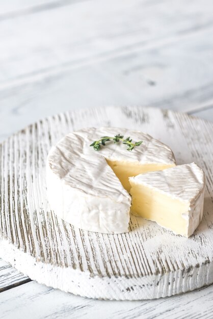 Camembert cheese on the wooden board