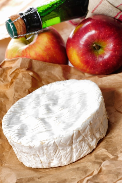 Camembert of Normandie with red apple