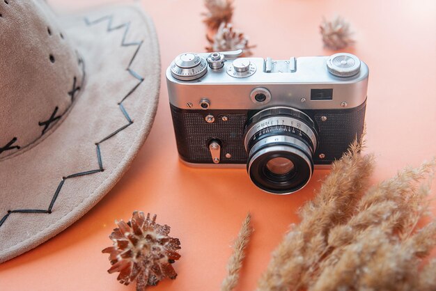 Camera on background with travel hat vacation concept