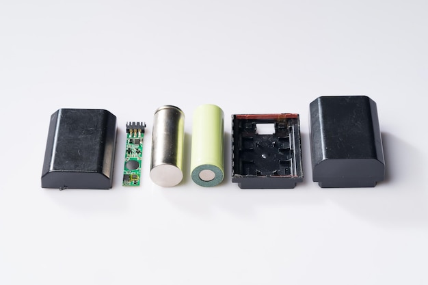 Camera battery and lithium battery on simple background