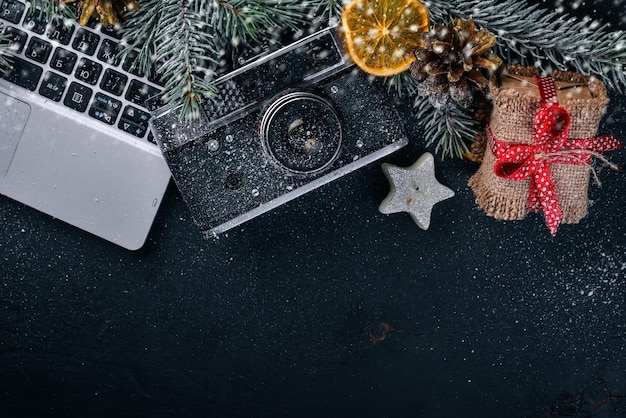 Camera Christmas wooden background New Year's holiday Christmas motive On a wooden surface Top view Free space for your text