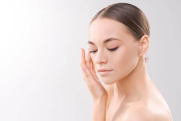 To camera isolated on background Young woman closeup portrait Healthy facial