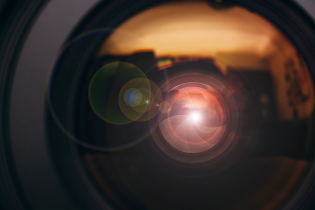 Photo camera lens with lense reflections.