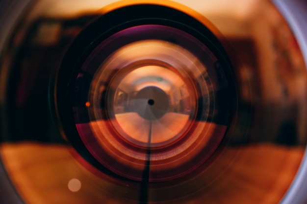 Photo camera lens with lense reflections.