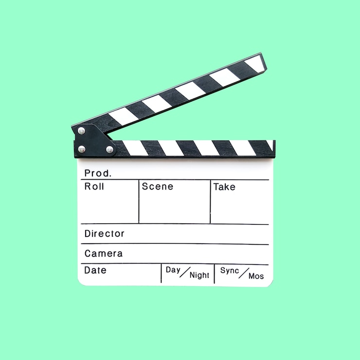 Photo camera slate the equipment for cinema post production isolated on green.