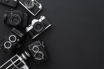 Premium Photo | Cameras on black background