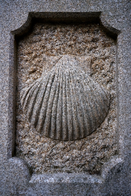 Camino Santiago stone shell sign in Combarro