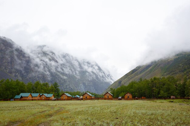 Camp in gorge between two cliffs covered with fog