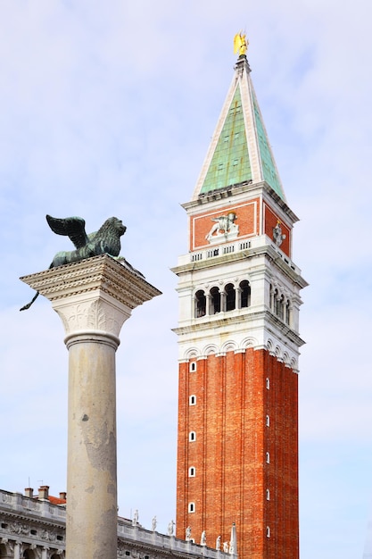 Campanile and winged lion on San Marco square, Venice, Italy