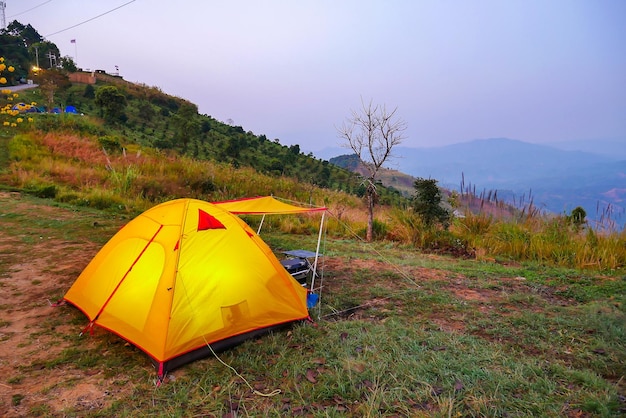 Camping tent at night in the forest