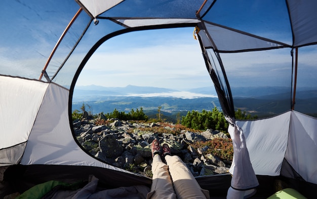 Camping on the top of mountain on bright summer morning