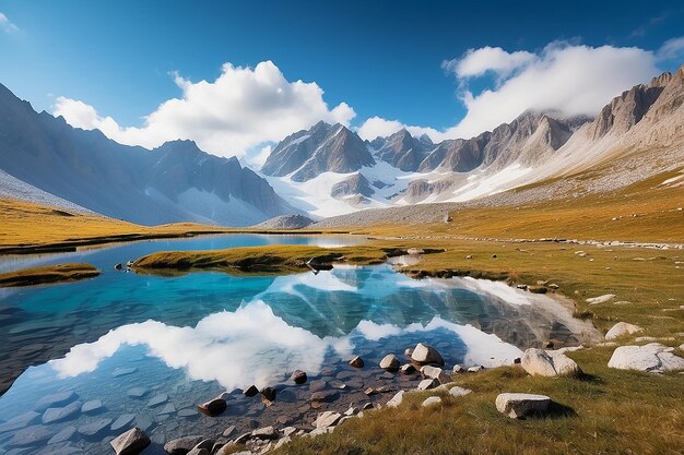 Photo camping with tent near high altitude lake on the alps reflection of snowcapped mountain range and scenic