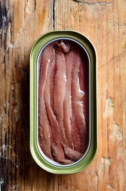 A can of anchovies on a table