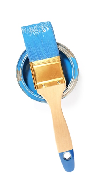can of blue paint with brush on white background top view