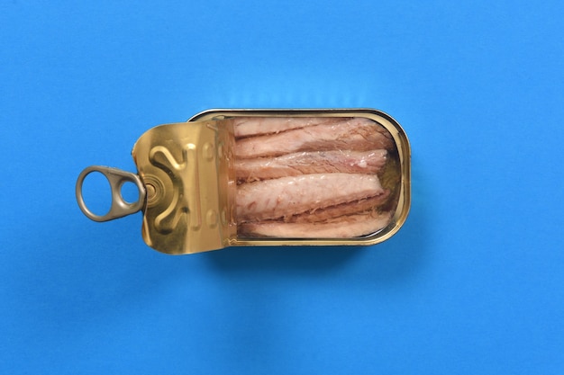 Photo can of mackerel on blue background