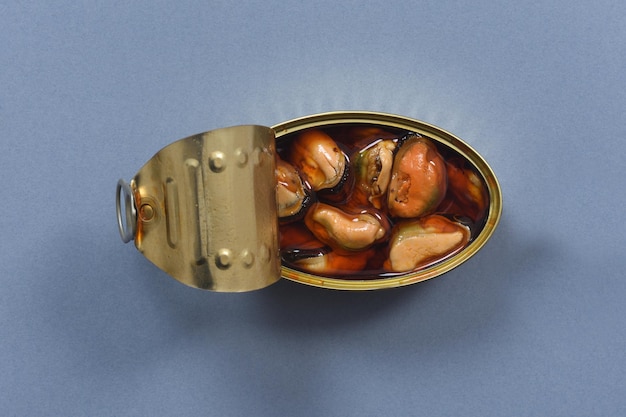 can of pickled mussel on grey background