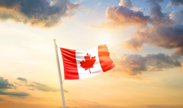 canada national flag waving in beautiful sky