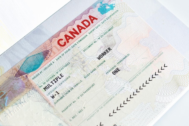 Canadian working visa in passport Immigration to Canada concept