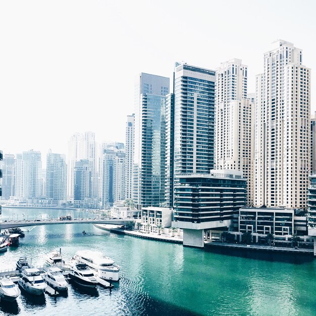 Canal by modern buildings at dubai marina