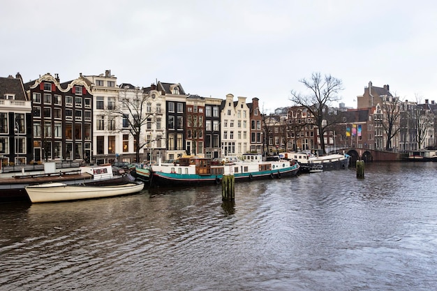 A canal with boats and buildings in amsterdam