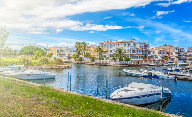 Photo canal with motor yachts spain empuriabrava on soft sunlight