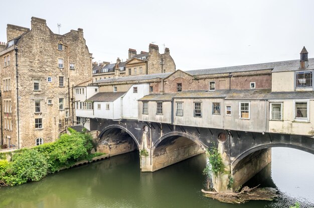 Canal with resident buildings with bridge in Bath England