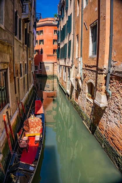 Canal with traditional gondolas in Venice, Italy