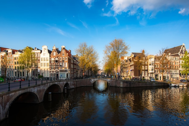 Canals of Amsterdam during sunset in Netherlands.