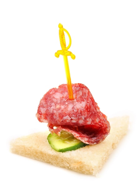 Canape sandwich with sausage isolated on white