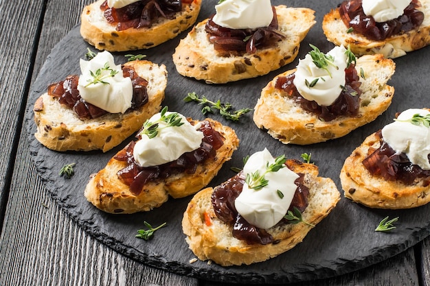 Canape with onion jam cream cheese and thyme