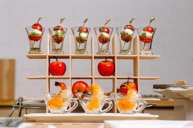 Canapes on toothpicks appetizer pinchos spanish Large table with luxury catering