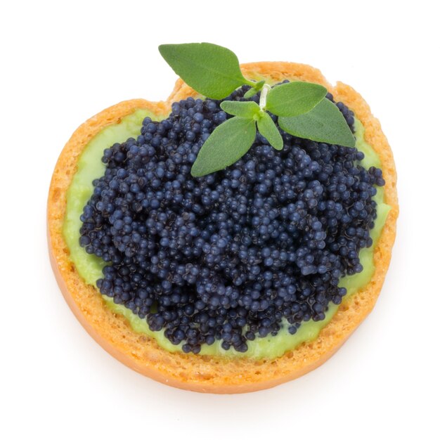 Canapes with black sturgeon caviar and  spice isolated on the white background.