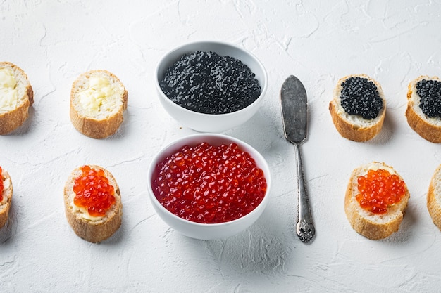 Canapes with black sturgeon, and salmon fish caviar