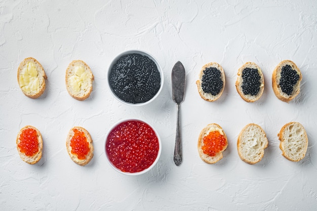 Canapes with black sturgeon, and salmon fish caviar,