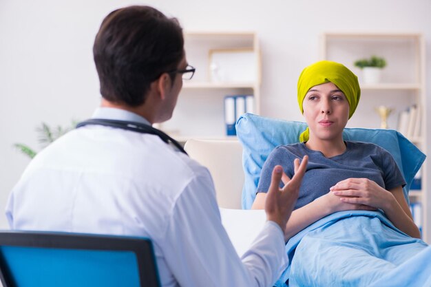 Cancer patient visiting doctor for medical consultation in\
clini