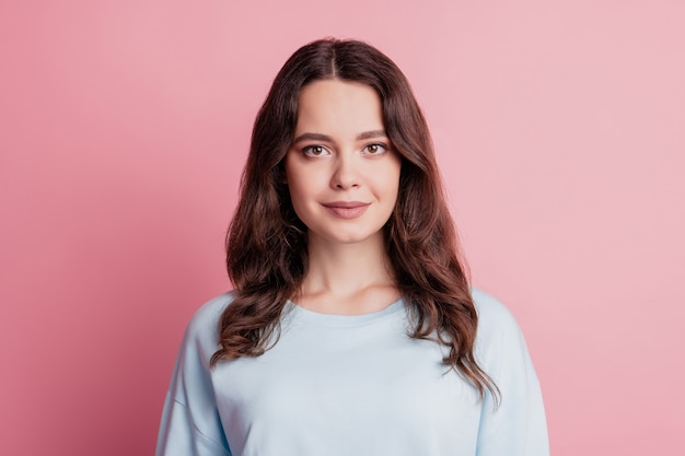 Candid girl smile positive cheerful face looking camera on pink background