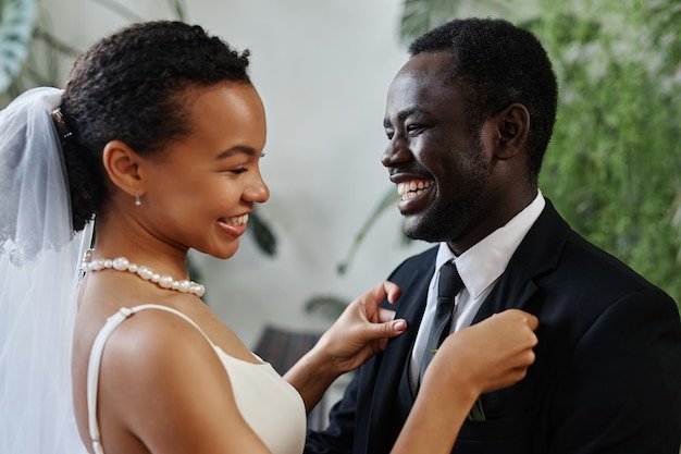 Candid happy bride and groom meeting before wedding ceremony