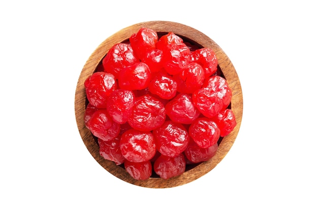 Candied fruit dried cherries with sugar in wooden bowl isolated on white background Vegan food top view