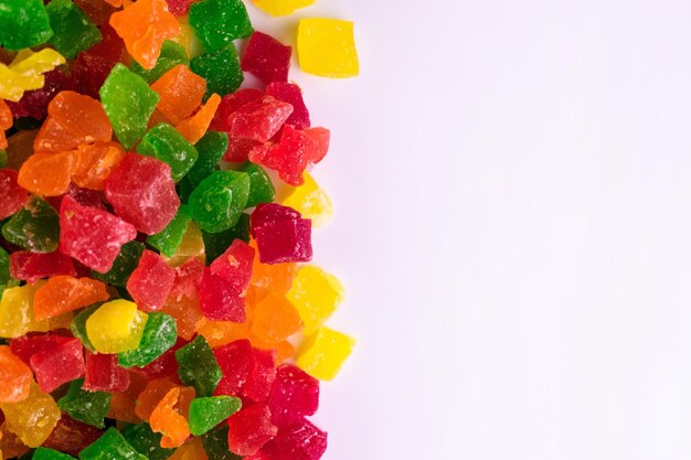 Candied fruits Dried fruits cubes on white background Copy Space