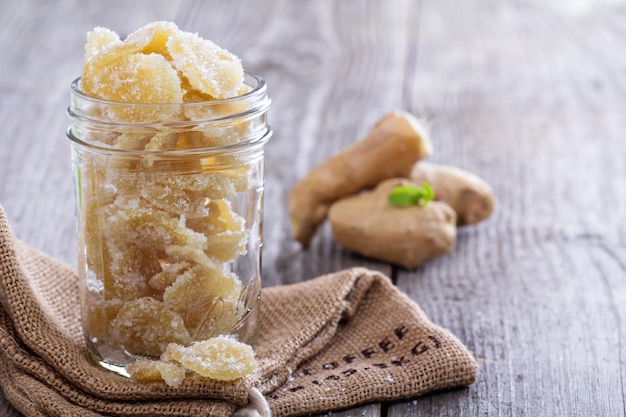 Photo candied ginger in a jar