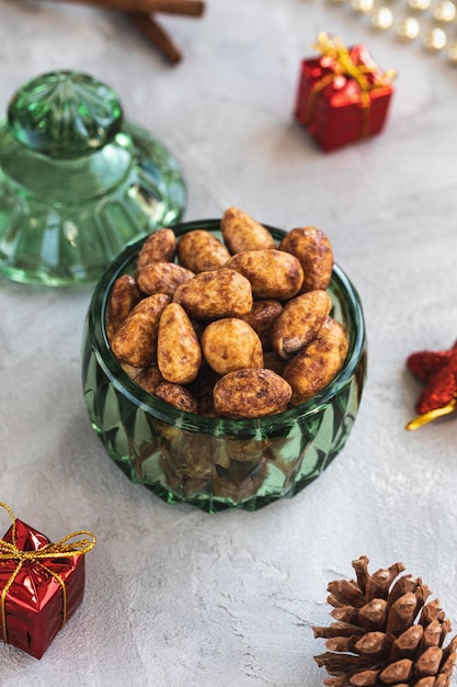 Candied or sugared almond in glass jar on christmas background