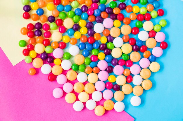 Candies on the colorful background high angle view