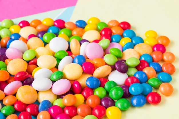 Candies on the colorful background, high angle view,