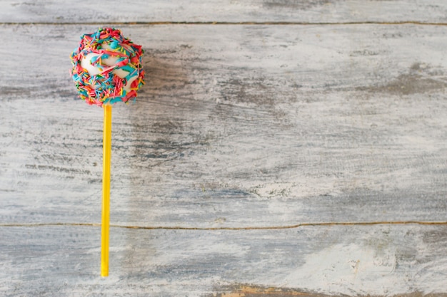 Candies on wooden surface.