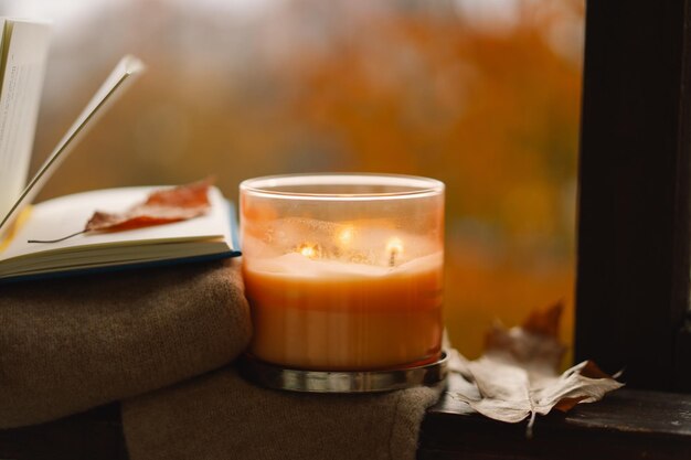 Candle and autumn decor autumn home decor cozy fall mood