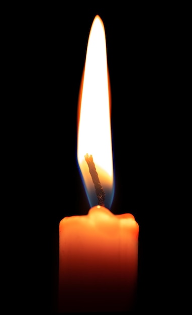 Photo candle flame on a black background close up