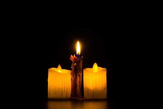 Candle flame close up on a dark background advent  prayer and meditation for peaceful mind and soul