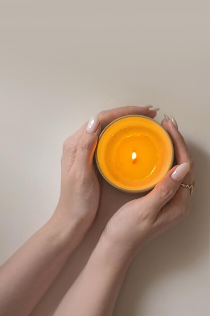 Candle in hand top view