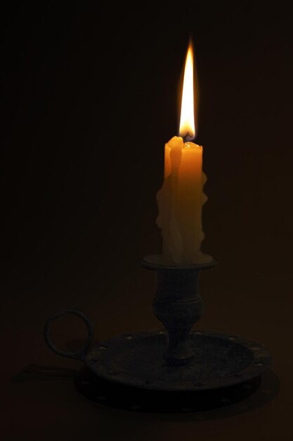 Candle illuminating the darkness